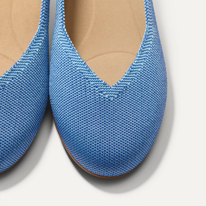 Close up of the toe and vamp of The Daily Flat in Clear Blue.