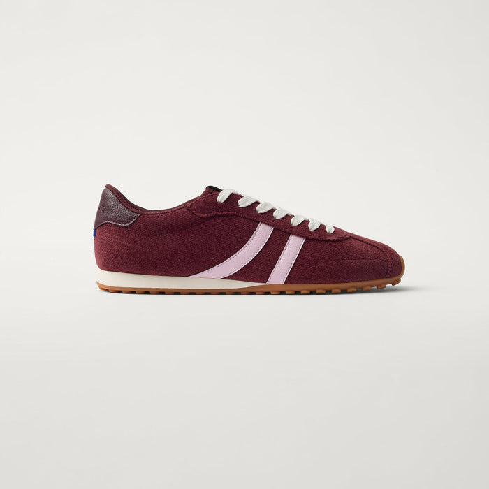 side | The Ivy Sneaker in ReVelvet Syrah shown from the side.
