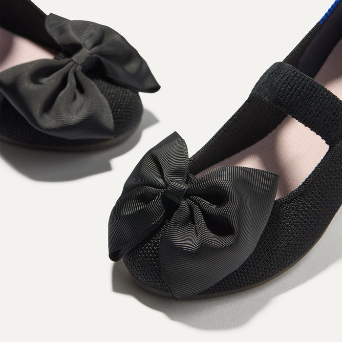 Close up of the bow detail of The Kids Big Bow Mary Jane in Black.