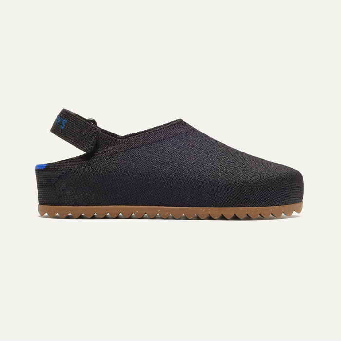 side | The Kids Clog in Black shown from the side.