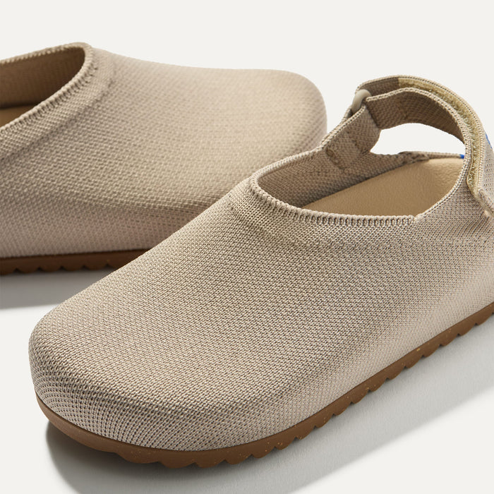 Close up of the rounded topline of The Kids Clog in Dove.