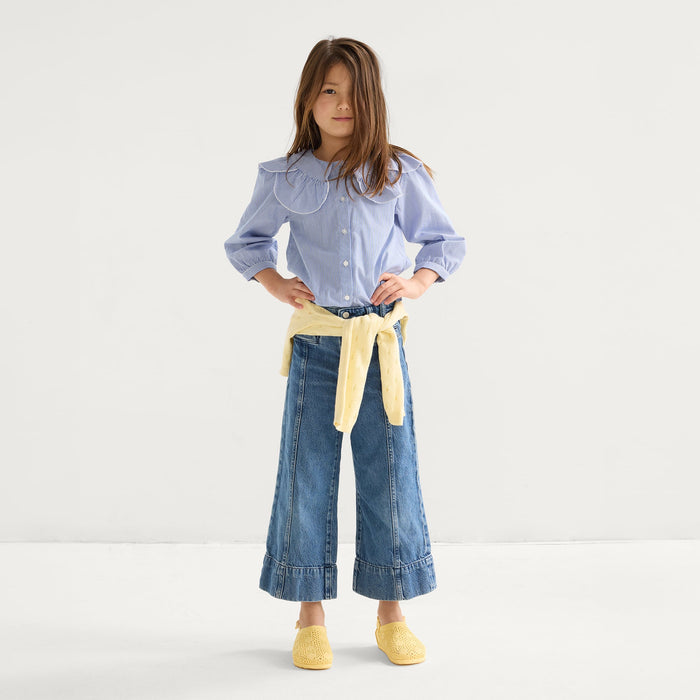 model | Alternate view of a child wearing The Kids Clog in Sunny Crochet.