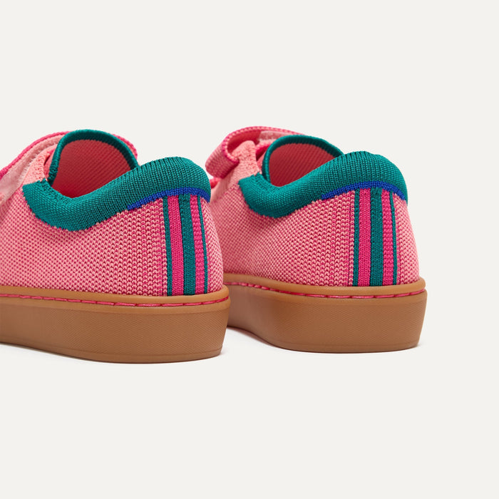 Close up of the heel of The Kids Strap Sneaker in Watermelon, with Rothy's signature blue halo.