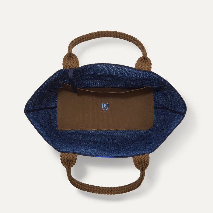 The Lightweight Tote in Dusk Open-Knit shown open from the top, with interior visible.