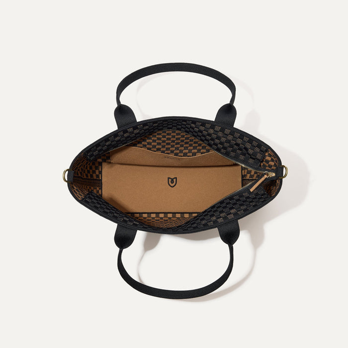 The Lightweight Zip Tote, shown from above with the interior exposed.