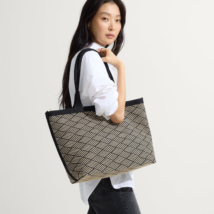 hover | Model shown holding The Lightweight Zip Tote in Polar Zig Zag.