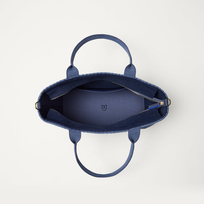 The Lightweight Zip Tote in ReVelvet Deep Navy, shown from above with the interior exposed.