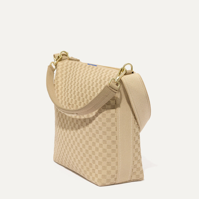 The Mini Zip Bucket in Knot Brown shown at a diagonal view from the left.