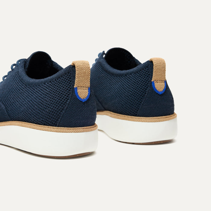 Close up of the heel of The Oxford in Night Navy, with Rothy's signature blue halo.