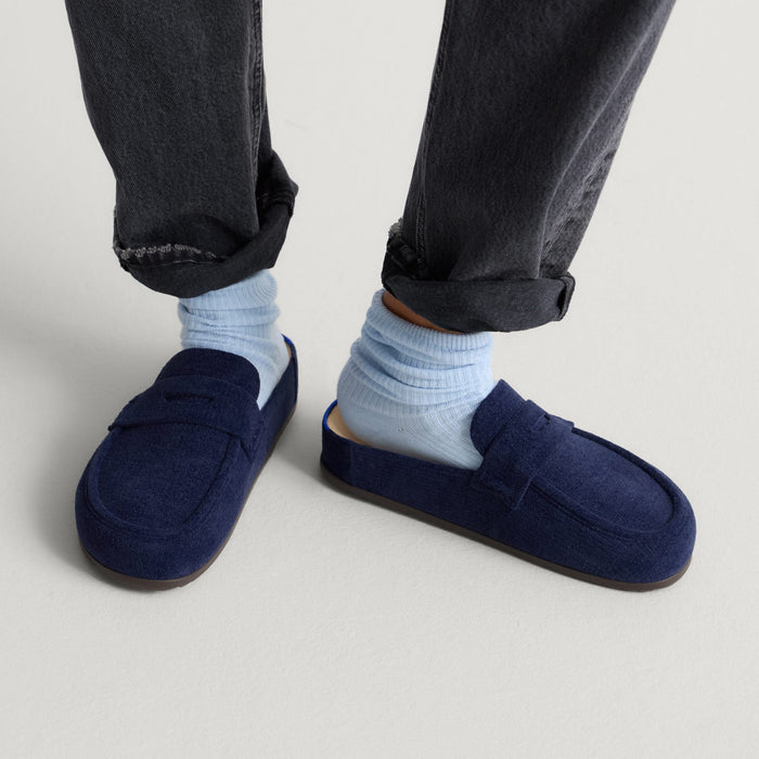 hover | Model wearing The Penny Clog in ReVelvet™ Navy.