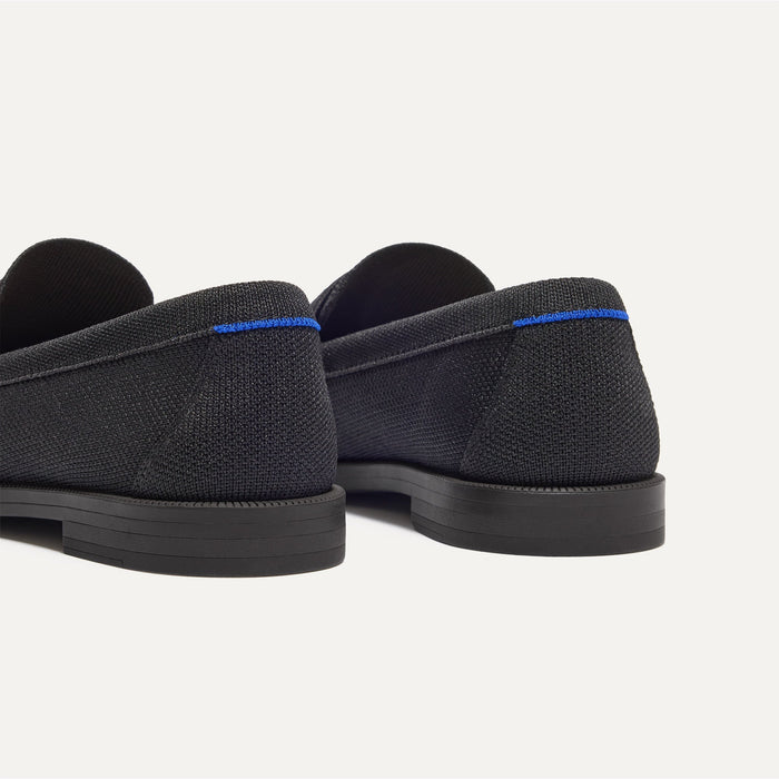 Close up of the heel of The Penny Loafer in Black, with Rothy's signature blue halo.