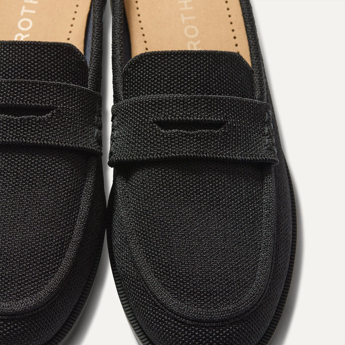 Close up of the toe and vamp of The Penny Loafer Mule in Black, showing the penny keeper detail.