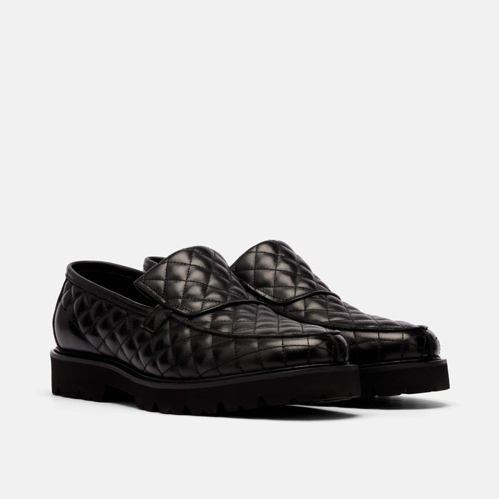 The Pitch Black Quilted Leather Lug Penny Loafers