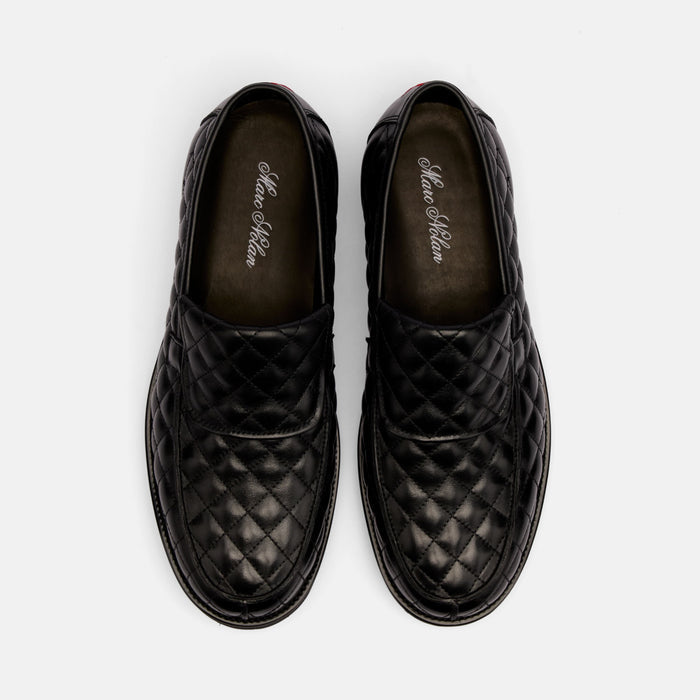The Pitch Black Quilted Leather Lug Penny Loafers