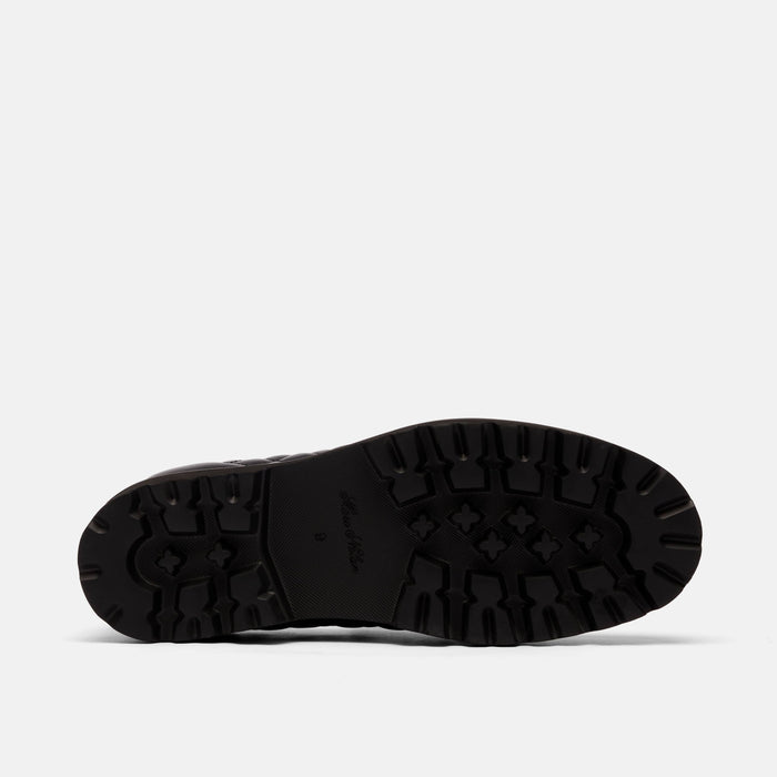 The Pitch Black Quilted Leather Lug Penny Loafers