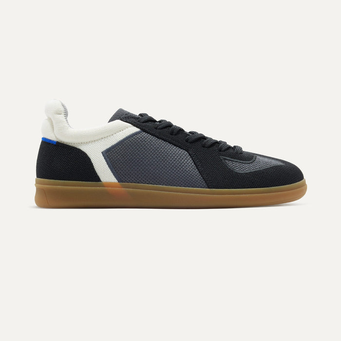 side | The RS01 Sneaker in Obsidian Black shown from the side.