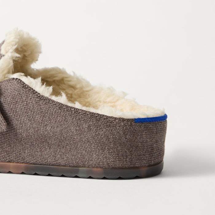 Close up of the heel of The Teddy Buckle Clog in Porcini, with Rothy's signature blue halo.