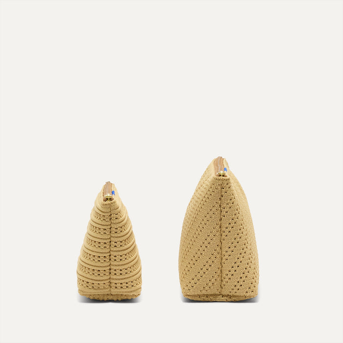 The small pouch of The Travel Pouch Set in Brown Butter Crochet shown  in diagonal view.