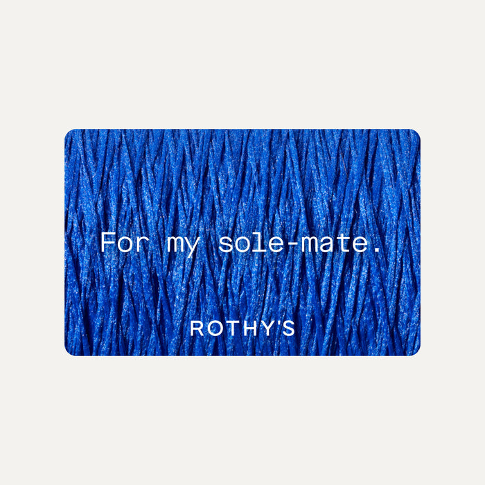 A gift card with blue thread behind white text that reads "For my sol-mate" and the Rothy's logo in white.