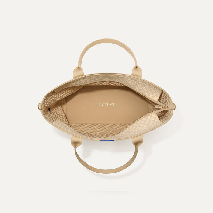 The Zip Travel Tote in Parchment Basketweave, shown from above with the interior exposed.
