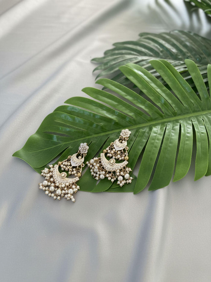 Tiered Polki Chaandbali With Pearl Jhumkas.