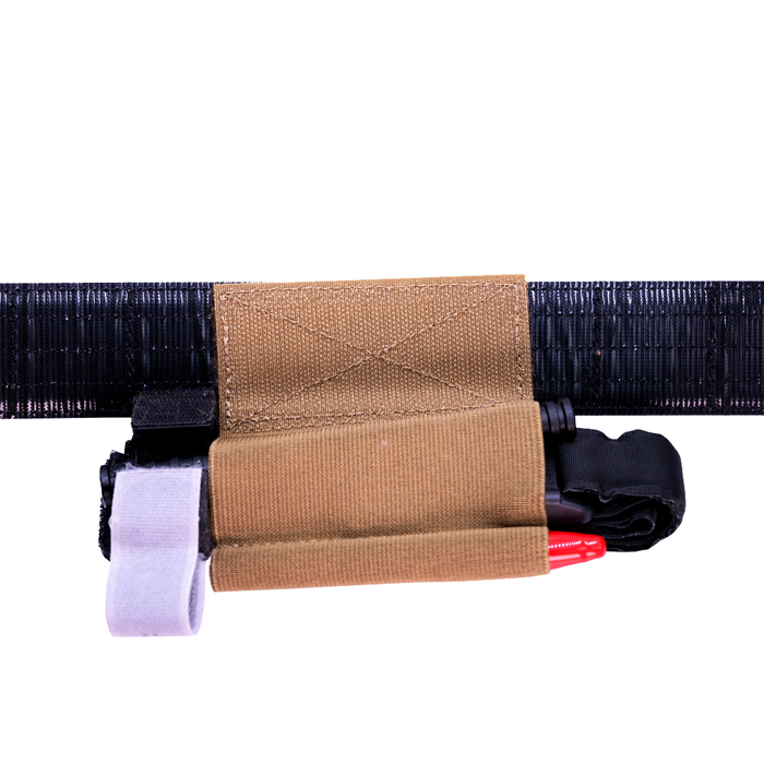 Backside Kore Essentials Coyote Tourniquet Holder with Tourniquet included attached to a Kore Molle Battle Belt