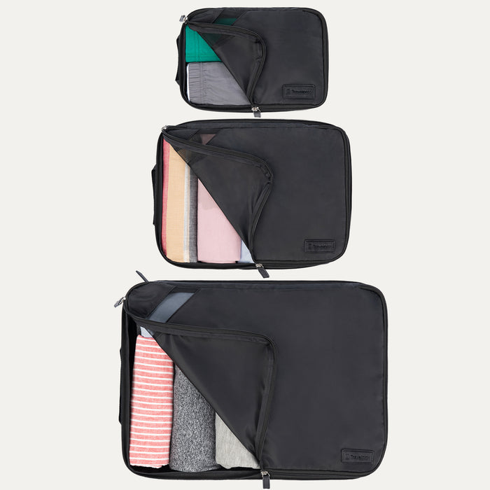 Top view of Travelpro Essentials 3 Pack Expandable/Compressible Packing Cube Set (Medium, Large, Extra Large) in BLACK, partially open to reveal neatly packed clothing.