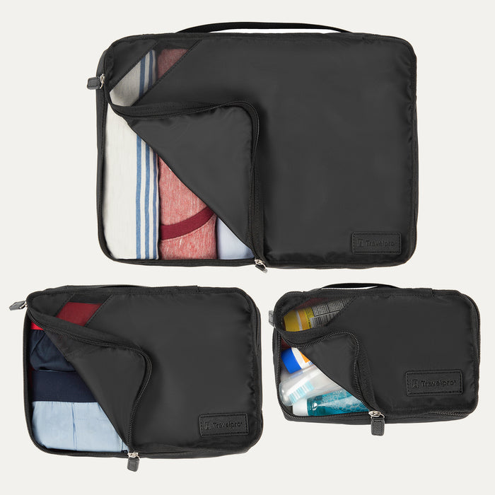 Top view of Travelpro Essentials 3 Pack Packing Cube Set (S/M/L) in BLACK, partially open to show packed clothing and toiletries.