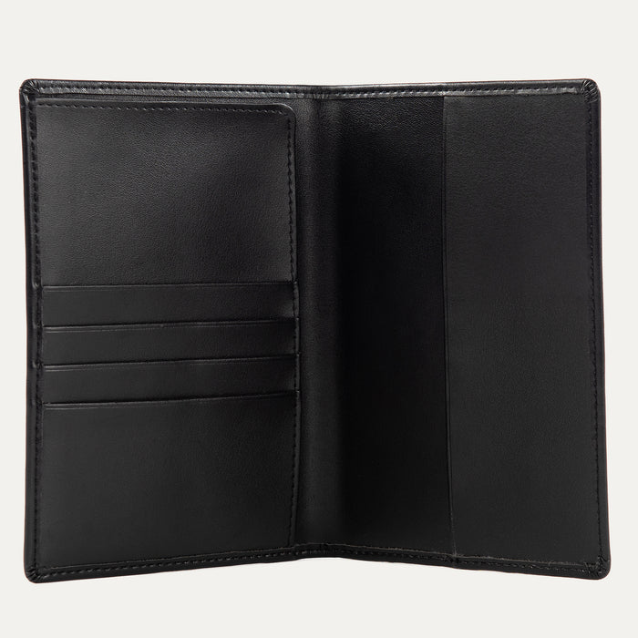 Interior view of a black Travelpro passport holder, featuring multiple card slots on the left and a large pocket on the right for securely holding a passport