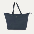 Front view of the Travelpro Essentials SparePack Foldable Tote 2.0 in Navy, highlighting its spacious design, durable carry handles, and lightweight, abrasion-resistant fabric.