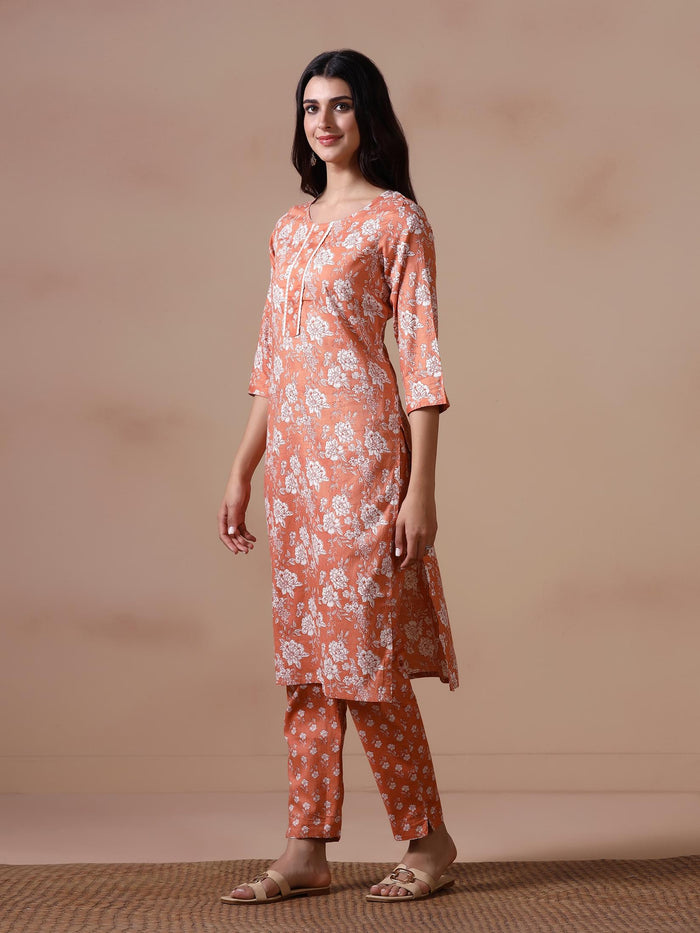 Women Cotton Peach Floral Print KurtaTrouser Dupatta.