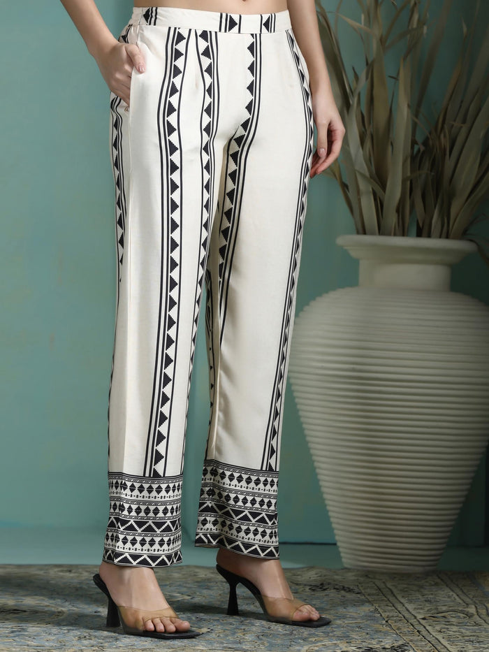 Women Liva Cream and Black Printed Kurta With Comfort Pant.