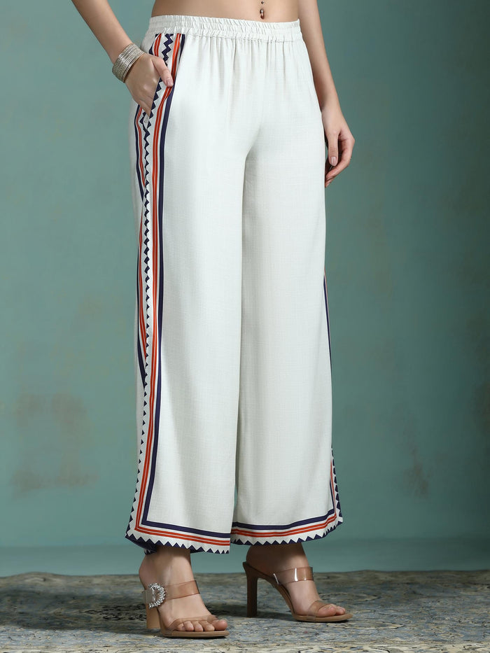 Women Liva Cream Printed Kurta With Comfort Pant.