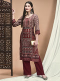 Women Liva Maroon Ornamental Print Kurta With Comfort Pant.