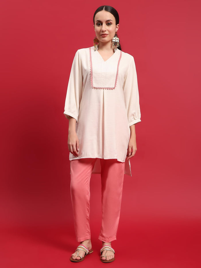 Women Liva Rayon Cream Solid Kurta With Trouser.