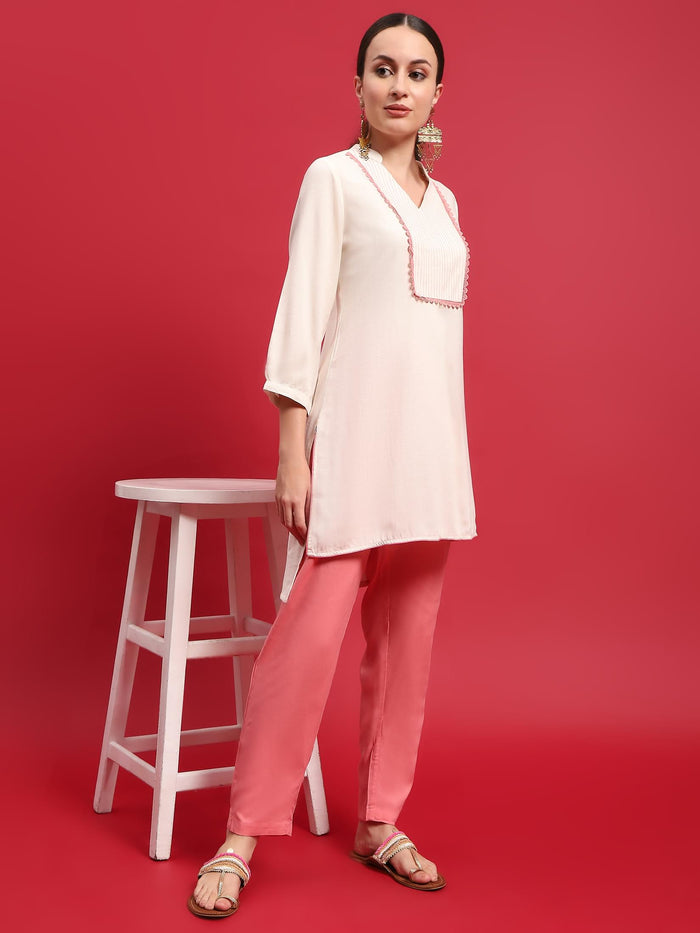 Women Liva Rayon Cream Solid Kurta With Trouser.