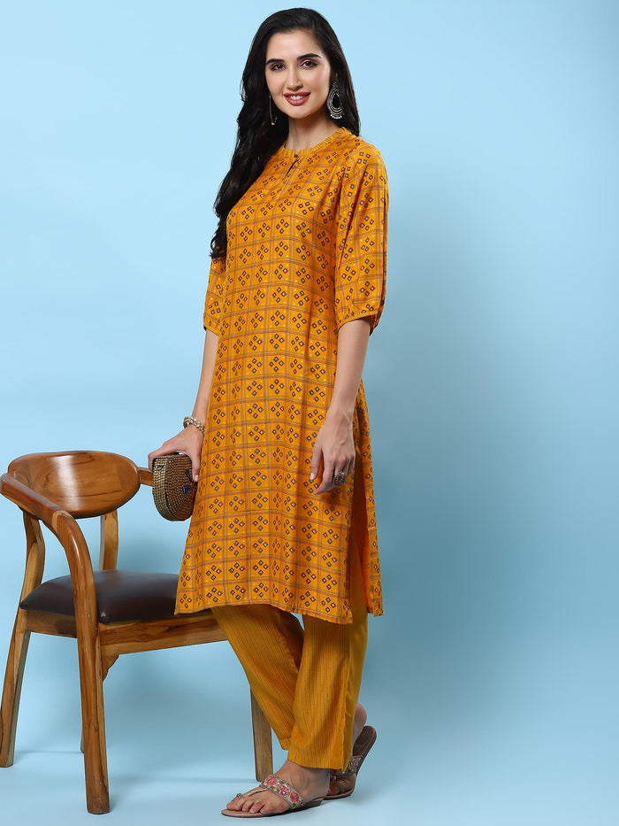 Women Mustard Geometric Printed Kurta With Comfort Pant.