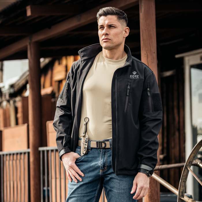 Man wearing a tan 499 1.5" nylon gun belt from Kore Essentials, with an X5 buckle.