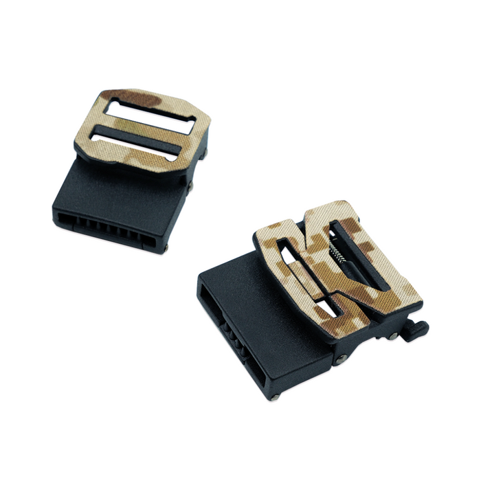 A Kore Essentials B2 Buckle and an X7 buckle wrapped in camouflage on a white background.